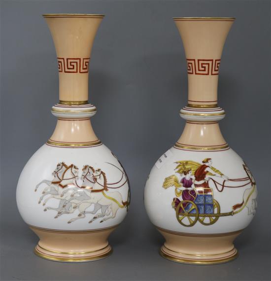 A pair of French porcelain bottle shaped vases, of bulbous form and cylindrical necks, height 36cm